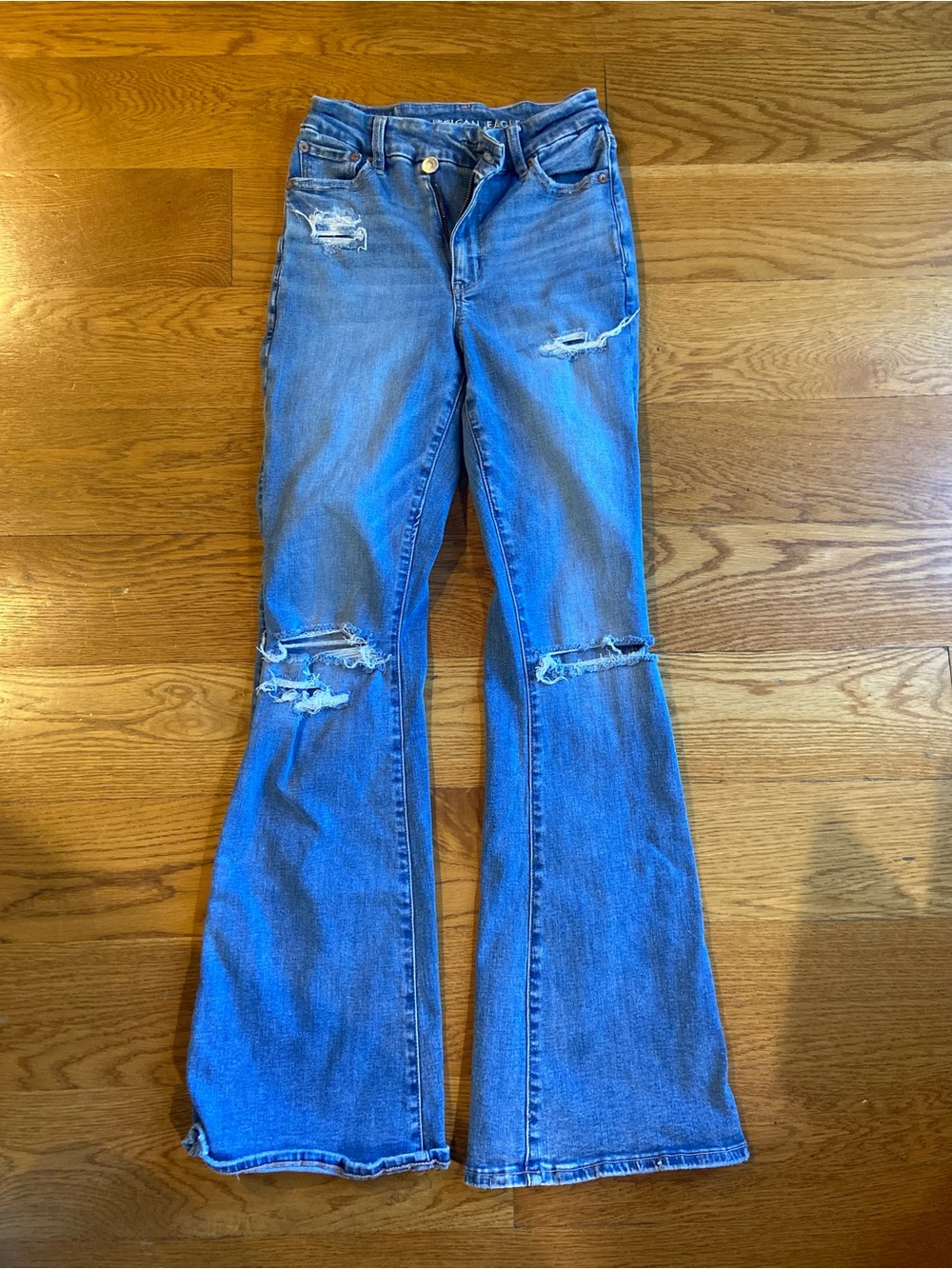 American Eagle Woman’s Next Level Ripped Super High-Waisted Flare Jeans